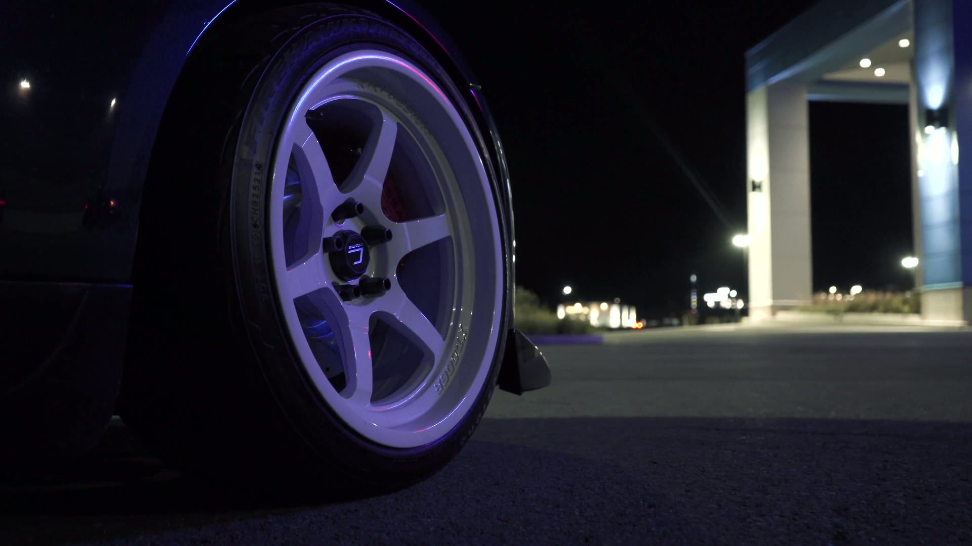 Close-up of a car wheel at night